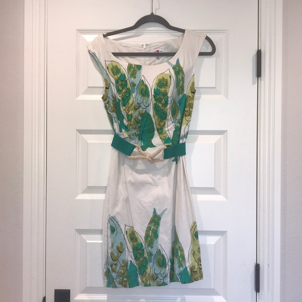 We love Vera green dress with a strap/rope belt.